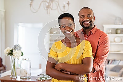 Mature black couple hugging and smiling Stock Photo