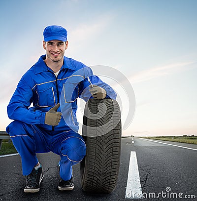 Smiling mechanic showing thumbs up Stock Photo