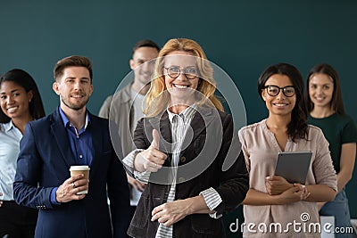 Multiracial businesspeople show thumb up recommend good company service Stock Photo