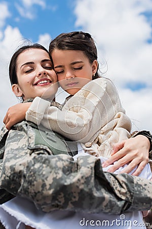 smiling military woman with closed eyes Stock Photo