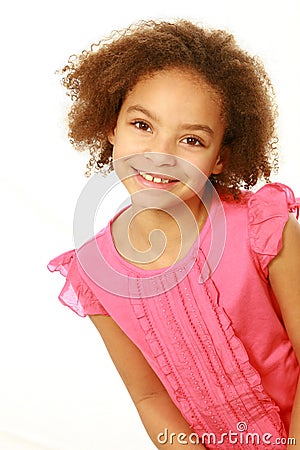 Smiling mixed race girl looking at camera Stock Photo