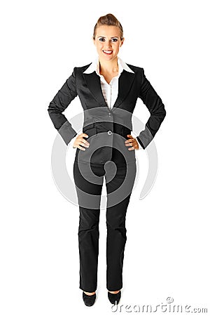 Smiling modern business woman with hands on hips Stock Photo