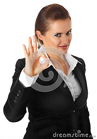 Smiling modern business woman showing ok gesture Stock Photo