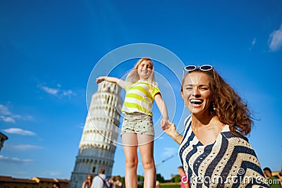 Smiling modern mother and daughter posing for tourist picture Stock Photo