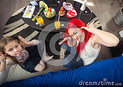 Smiling mother and cheerful daughter together playful on Easter Stock Photo
