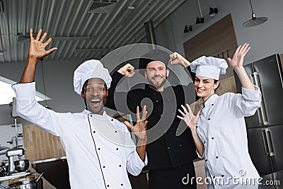 smiling multicultural chefs having fun Stock Photo