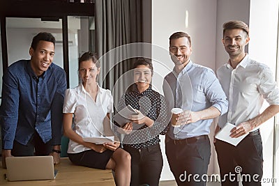 Smiling multiethnic team stand making group picture together Stock Photo