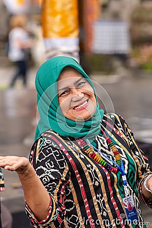 Smiling Muslim woman at Ulun Danu Beratan Temple complex, Bedoegoel, Bali Indonesia Editorial Stock Photo