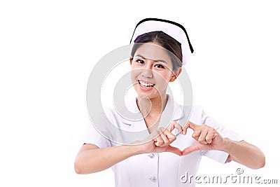 Smiling nurse making heart symbol hand gesture Stock Photo