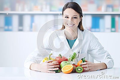 Smiling nutritionist in her office Stock Photo