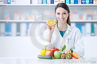 Nutritionist holding a sliced orange Stock Photo