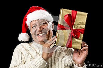 Smiling Old Man With Golden Gift Isolated On Black Stock Photo