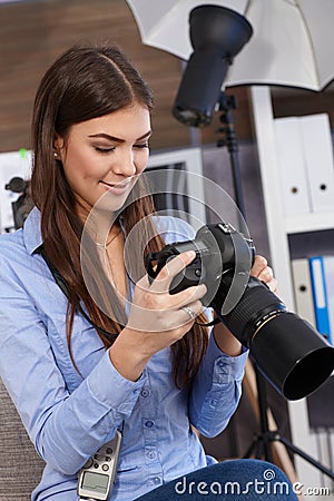 Smiling photographer at work Stock Photo