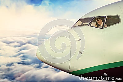 Pilot in the cockpit of the plane at height Stock Photo
