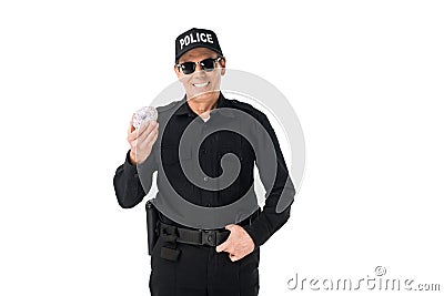 Smiling policeman holding doughnut isolated Stock Photo