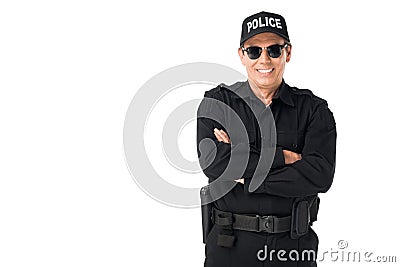 Smiling policeman wearing uniform with arms folded Stock Photo