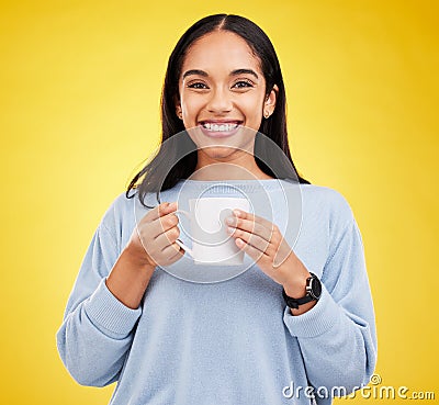 Smiling portrait, coffee mug and happy woman in a studio with a smile from espresso. Isolated, yellow background and Stock Photo