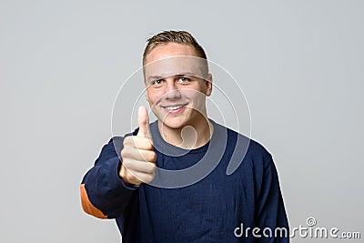 Smiling positive handsome young man Stock Photo