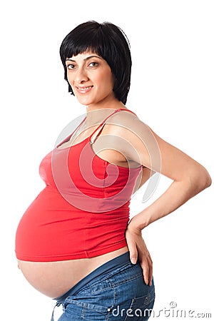 Smiling pregnant woman over white background Stock Photo