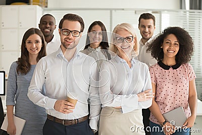 Smiling professional business leaders and employees group team portrait Stock Photo
