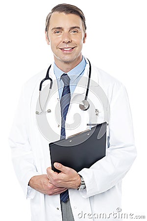 Smiling professional physician carrying clipboard Stock Photo