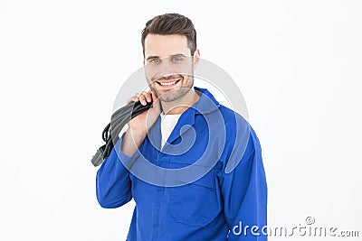 Smiling repairman holding cable Stock Photo