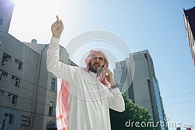 Smiling rich arabian man`s buying real estate in the city Stock Photo