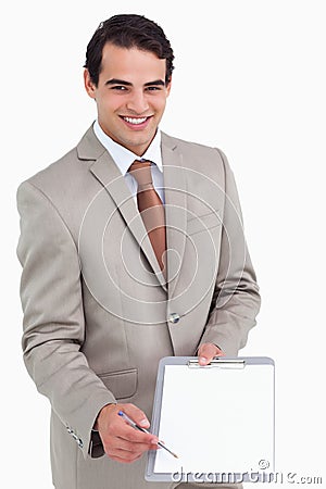 Smiling salesman asking for signature Stock Photo