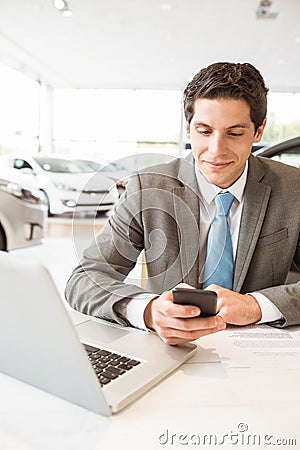 Smiling salesman having a phone call Stock Photo