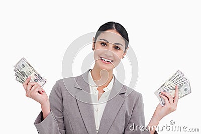 Smiling saleswoman with money in her hands Stock Photo