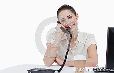 Smiling secretary answering the phone Stock Photo