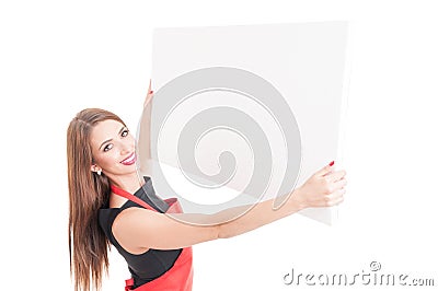 Smiling seller rising up empty billboard Stock Photo