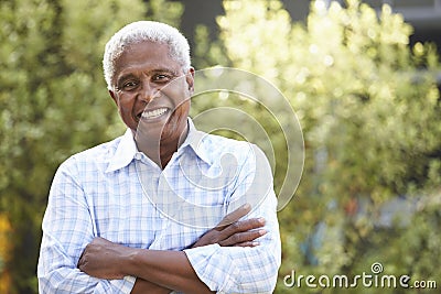 Smiling senior African American man with arms crossed Stock Photo