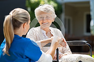 Nurse takes care of old patient Stock Photo