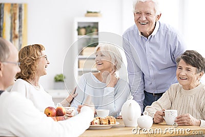 Smiling senior people enjoying meeting Stock Photo