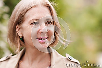 Smiling senior woman outdoors Stock Photo