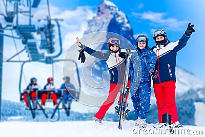 Smiling ski friends skiing alps resort Stock Photo