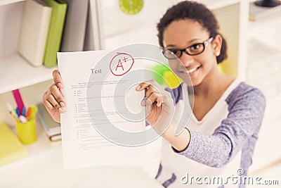 Smiling Smart Young Girl with Perfect Test Results Stock Photo