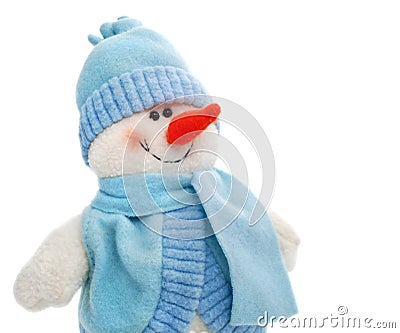 Smiling snowman toy dressed in scarf and cap Stock Photo