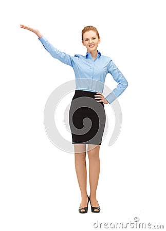 Smiling stewardess showing direction Stock Photo