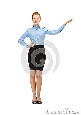 Smiling stewardess showing direction Stock Photo