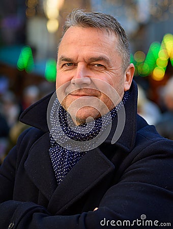 Smiling stylish middle-aged man in winter outfit Stock Photo