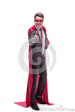 Smiling superhero businessman showing thumbs up . isolated on white Stock Photo