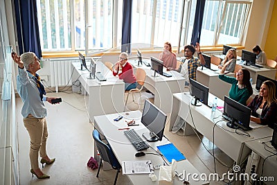 Teacher lecturer on class giving presentation young students on university Stock Photo