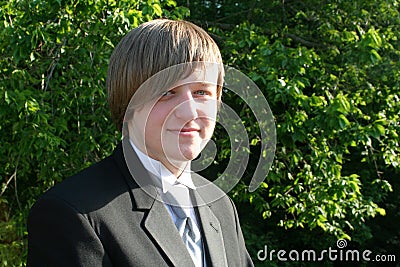 Smiling Teen Boy In Black Tuxedo Horizontal Stock Photo