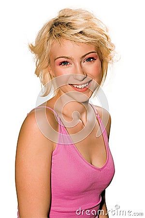 Smiling teen woman in pink shirt Stock Photo