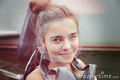 Smiling teenage girl with lifejacket Stock Photo