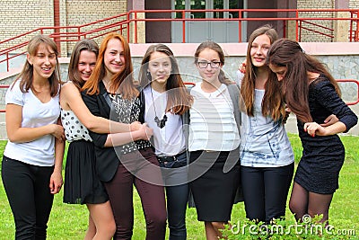 Smiling Teenage Girls front of the School Stock Photo