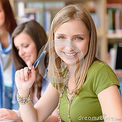 Smiling teenage student girl at study room Stock Photo