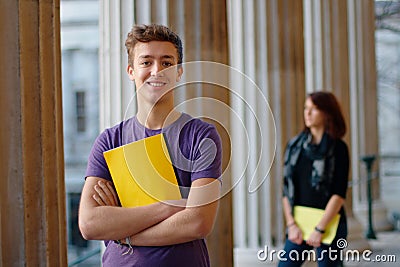 Smiling teenage student outdoors Stock Photo